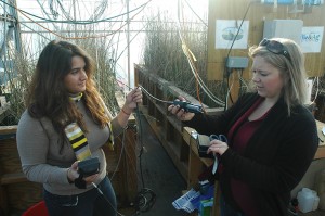 Maggie Rabiipour (left) and Messer (right) show a sensor they use for monitoring the mesocosms. Photo Courtesy Rhett Register.