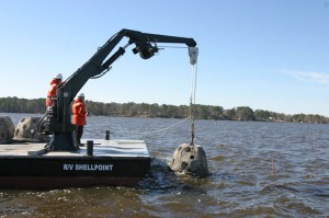 The Shellpoint's crew carefully deposit a reef ball into the Neuse River near Oriental. 