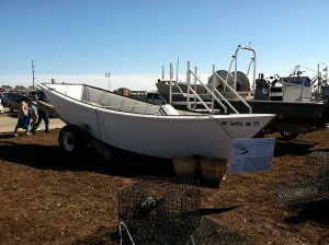 The beach dory shown next to crab cages.