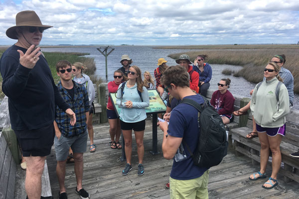 Group of people on marsh edge