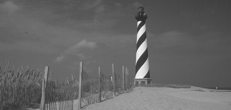 A black and white picture of a lighthouse