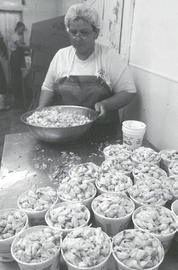 Sea Safari worker packs crabmeat
