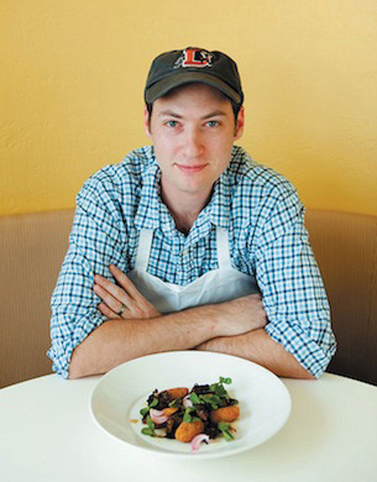 Aaron Crawford with a plated dish.