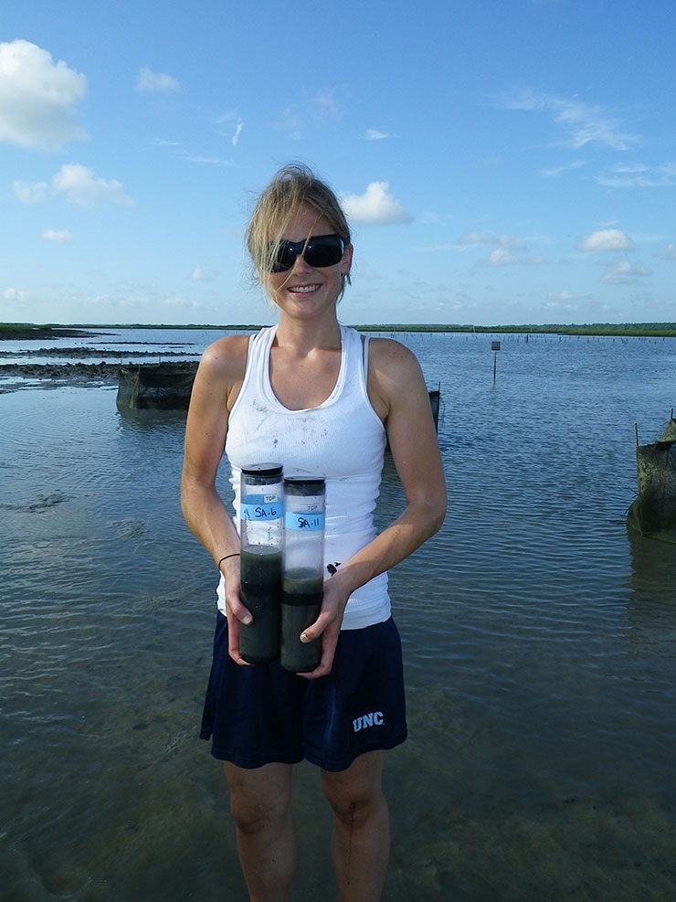 Ashley Smyth collects sediment cores for nitrogen measurements.
