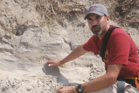 Rodriguez shows how geologists use sand layers to date storms.