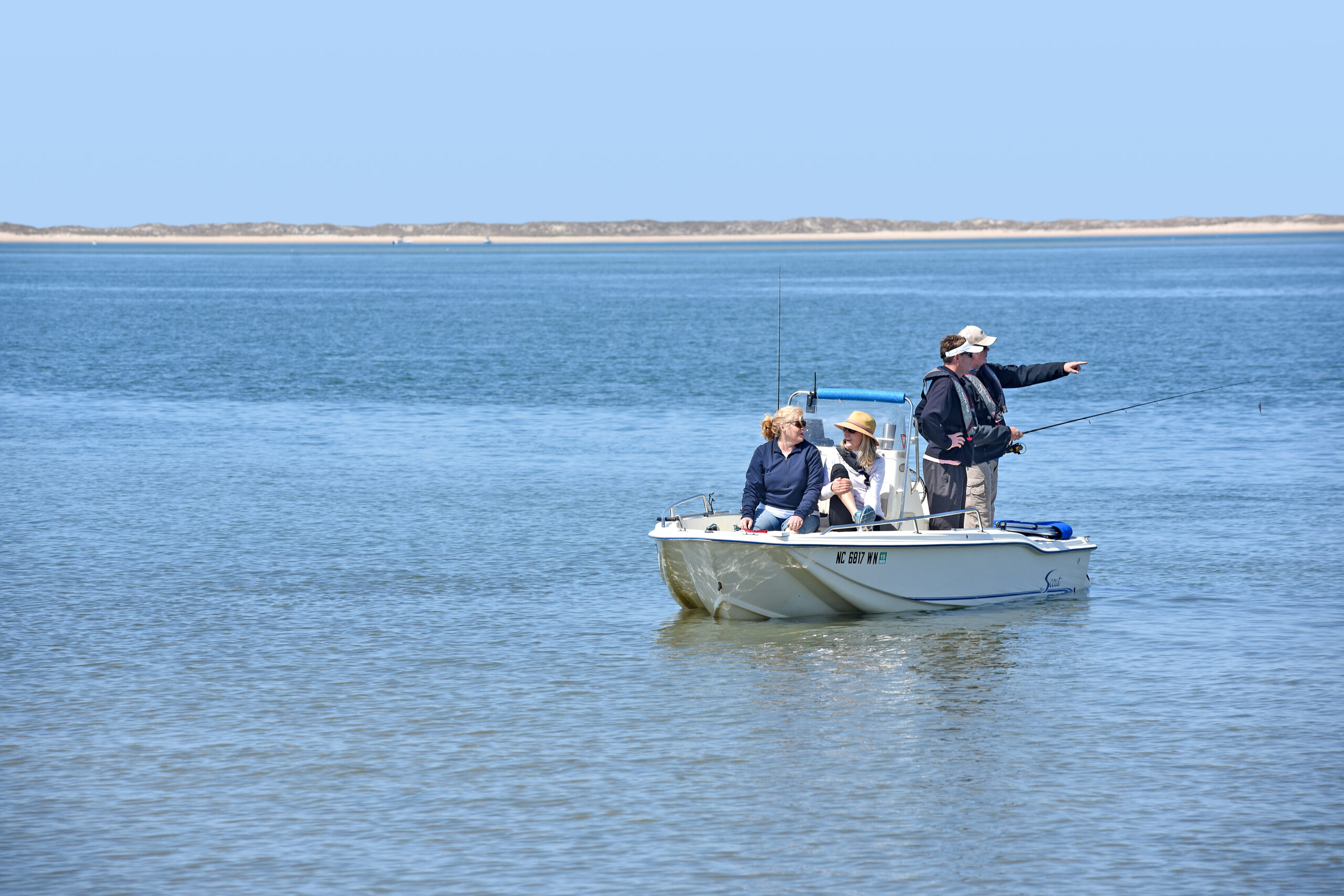 image: Boating visitors at Cape Lookout.