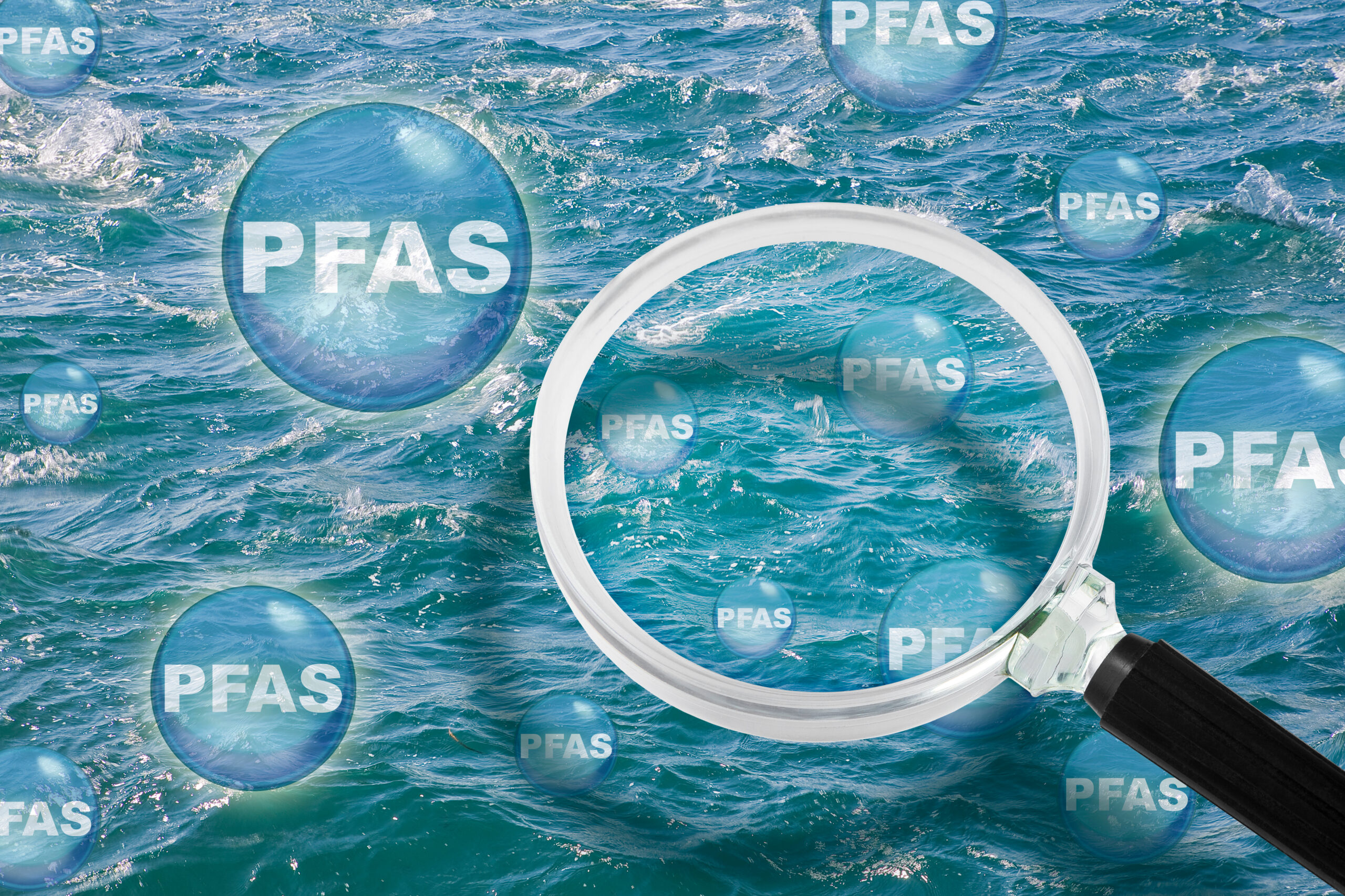 image: graphic of a magnifying glass over water with bubbles that say "PFAS".