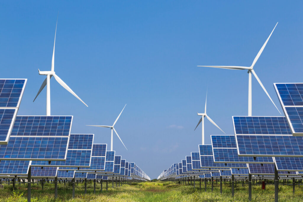 image:solar panels and wind turbines generating electricity.