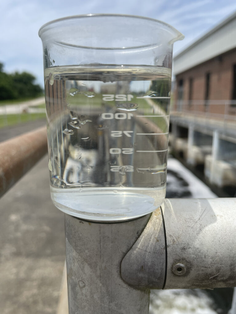 image: beaker of treated water.
