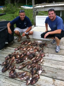 Brent Greenberg and Charlie Coffman display their share of more than 250 lionfish,