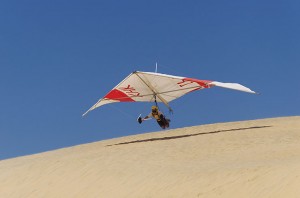 A hang glider takes off atop Jockey's Ridge.