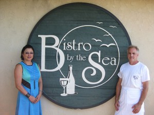 Libby Eaton and Tim Coyne in front of Bistro by the Sea.