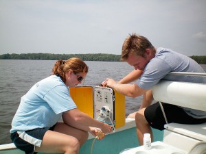 Coley Hughes and Joey Smith collect water samples for analysis in the Perquimans River.