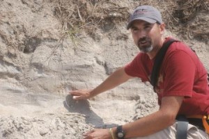 Rodriguez shows how geologists use sand layers to date storms.