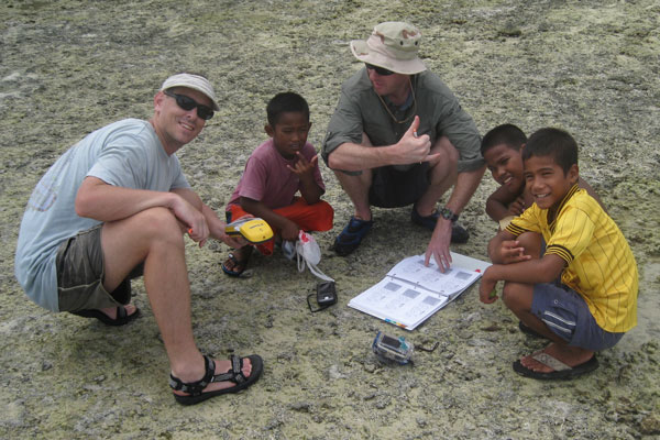 Matt Kendall, left, mapped coral reefs in Majuro in the Marshall Island. Photo courtesy NOAA Biogeography Branch