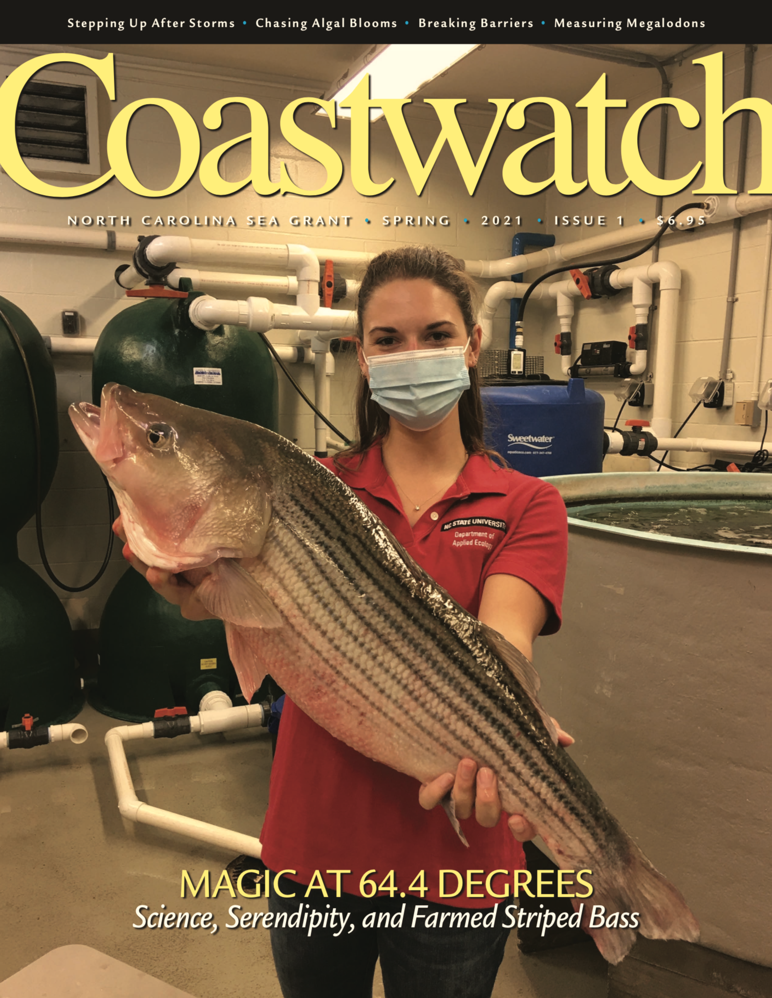 image: cover of the 2021 Spring Issue, researcher holds a striped bass