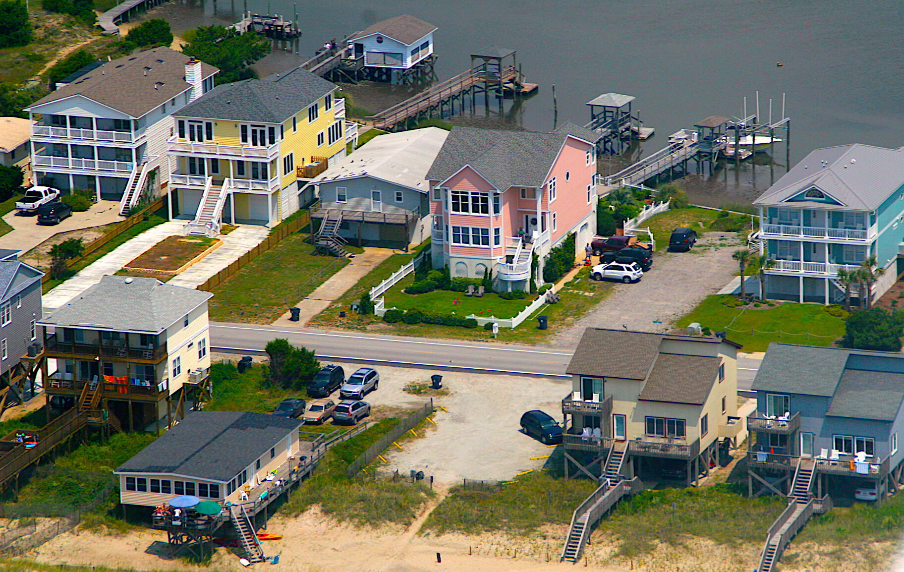 In 1986, Rogers helped start a committee that looked at building code requirements and recommended increasing the depth of pilings and the way buildings were constructed in North Carolina. Today, raised homes are prevalent along the coast, like these at Holden Beach. Credit: Doc Searls CC BY-SA 2.0.