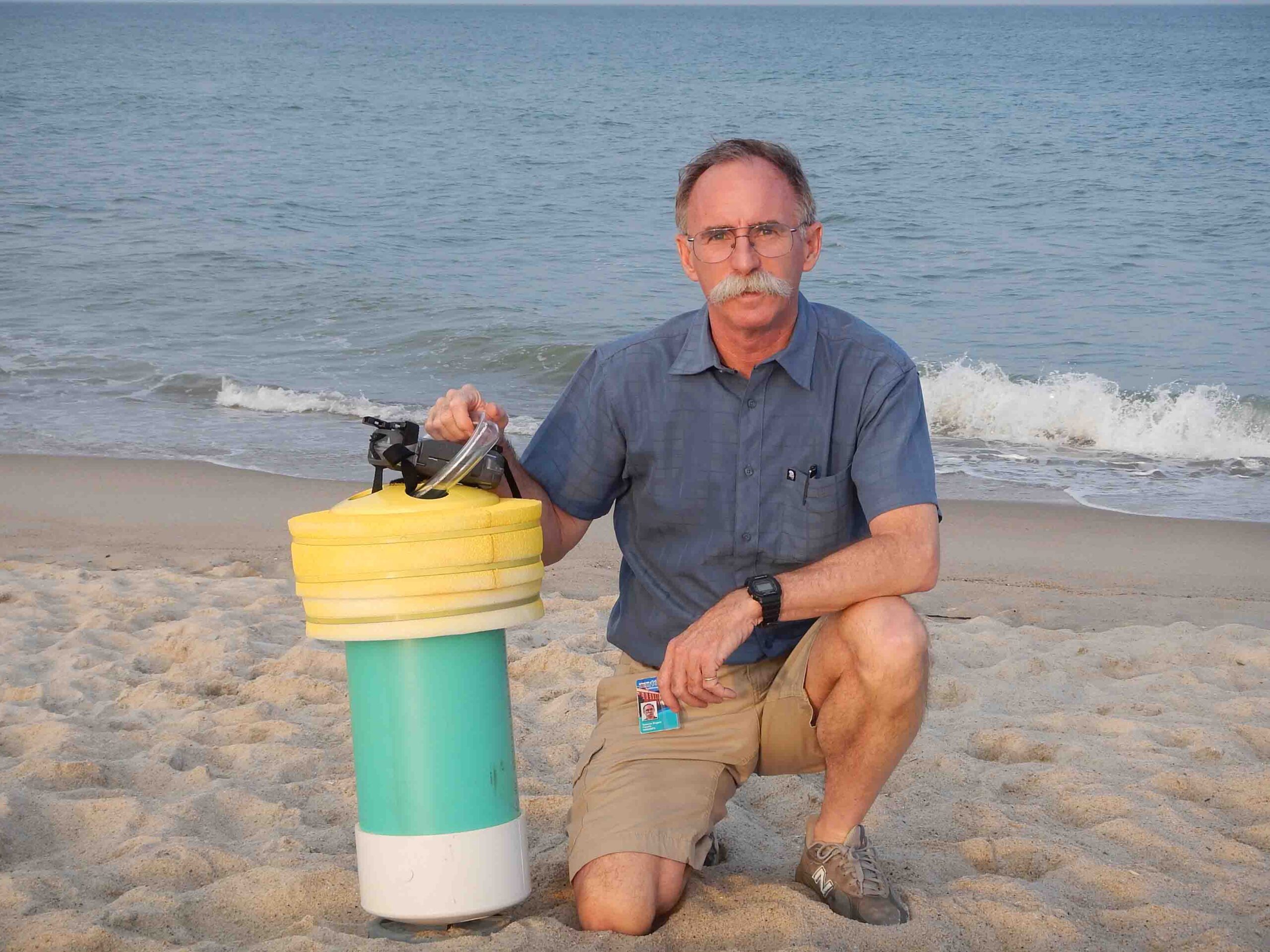 Rogers used GPS-fitted drifters (like the one he holds here) to study the patterns of water flow in rip currents.