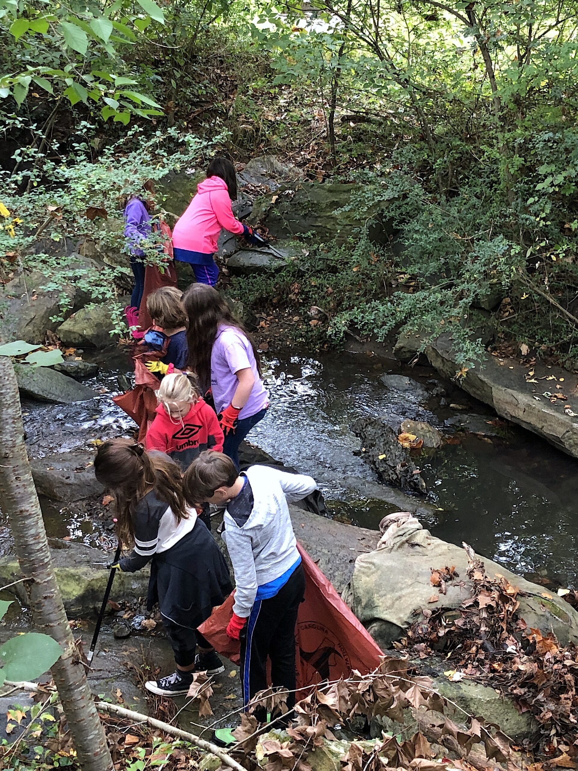 image: As students explore creek beds and waterways and participate in similar projects, they gain valuable experience and often become invested in the environment. Credit: Jenna Hartley.