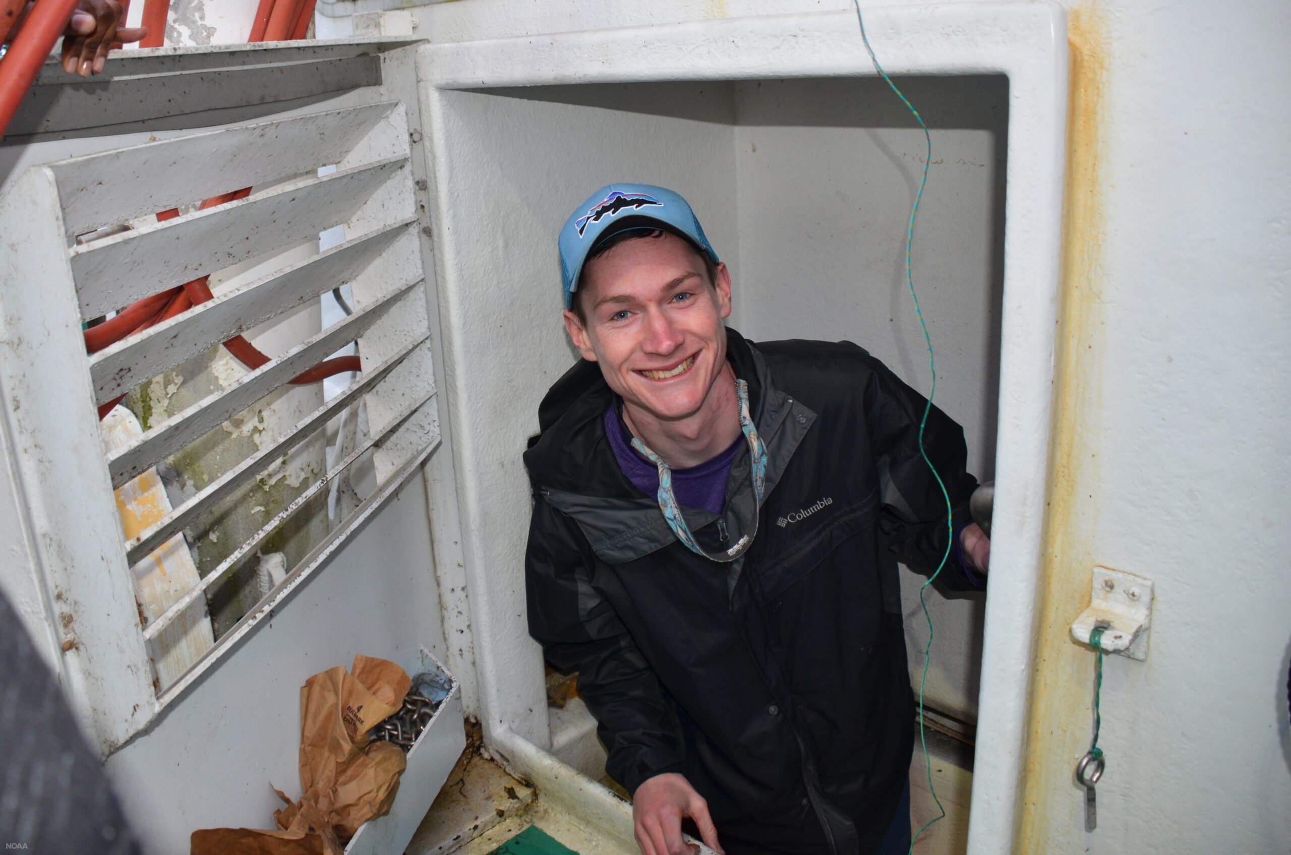 Kenneth Erickson climbs out of the engine room of a commercial fishing vessel in Louisiana during the Louisiana Sea Grant Graduate Research Scholar’s trip in December of 2018
