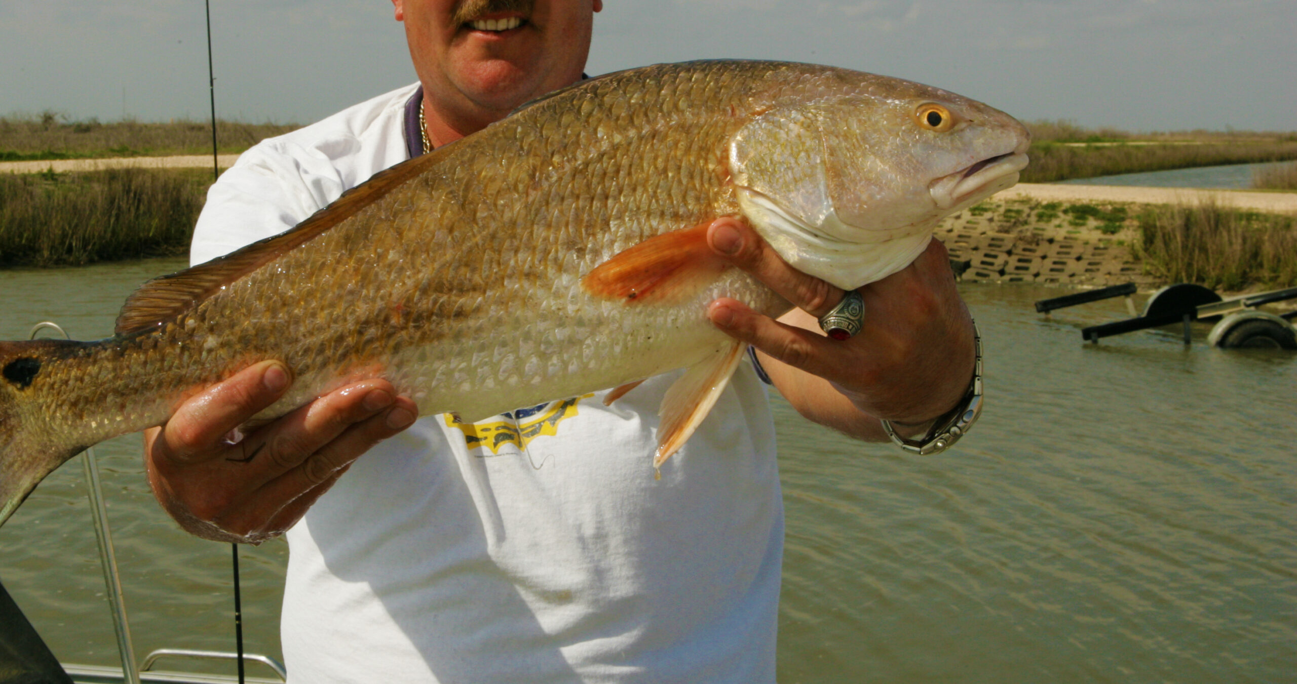 Man holding a red drum