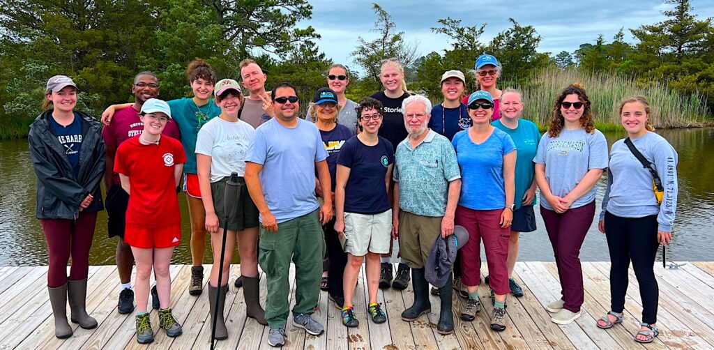 Participants of the 2023 inaugural Mid-Atlantic Marine Bioinvasions Rapid Assessment Survey. Front row, left to right: El Hartshorn (University of Rhode Island), Samantha Parsons (Salve Regina University), Rob Aguilar (Smithsonian Environmental Research Center), Judy Pederson (MIT Sea Grant Program), Megan McCuller (the North Carolina Museum of Natural Sciences), Jim Carlton (Williams College-Mystic Seaport Coastal & Ocean Studies Program), April Blakeslee (East Carolina University), Amy Fowler (George Mason University), Sarah Greenberg (George Mason University), and Sara Labbe (Salve Regina University). Back row, left to right: Danielle Moloney (Salve Regina University), Drew Davinack (Wheaton College), Clara Benadon (Williams-Mystic Program), Niels Hobbs (University of Rhode Island), Kristen Larson (Smithsonian Environmental Research Center), Carter Stancil (East Carolina University), Miranda Andersen (Smithsonian Environmental Research Center), and Carol Thornber (University of Rhode Island).