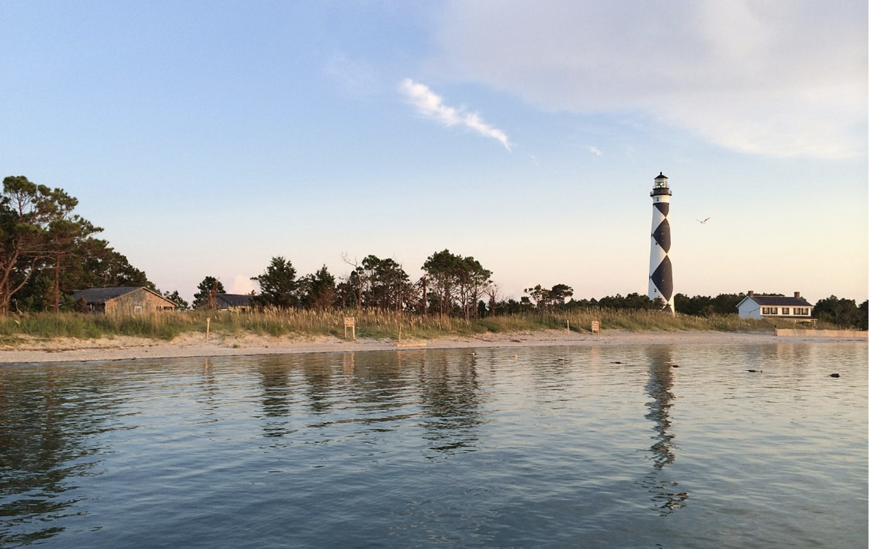 image: lighthouse on beach.