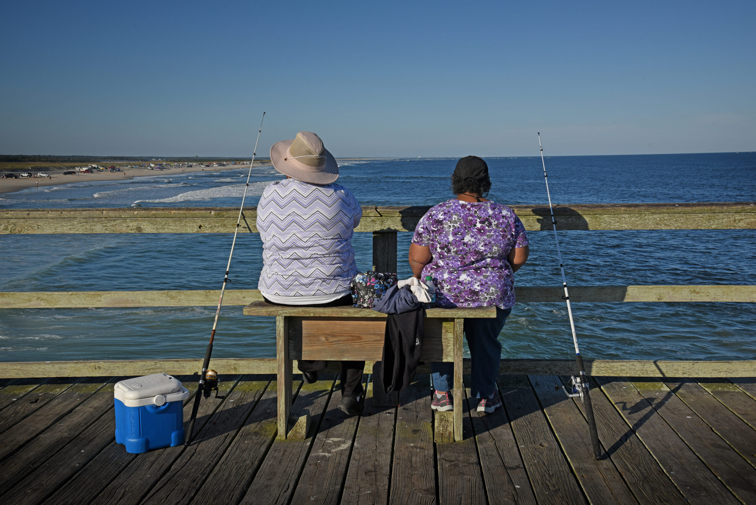 image: fishing from a pier.