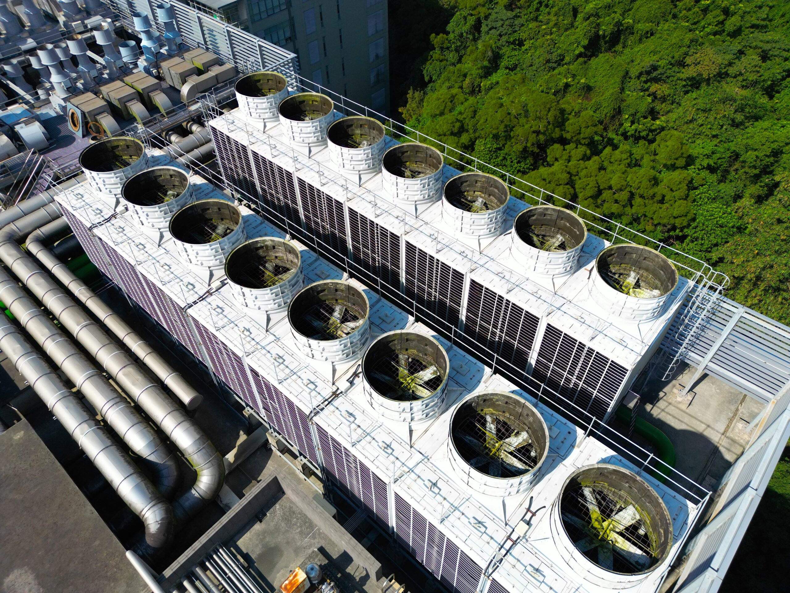 image: Aerial view of rooftop cooling towers for AI data center and cloud computing facility.