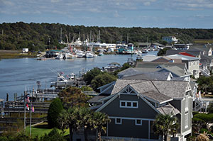 Boats, houses along waterfront.
