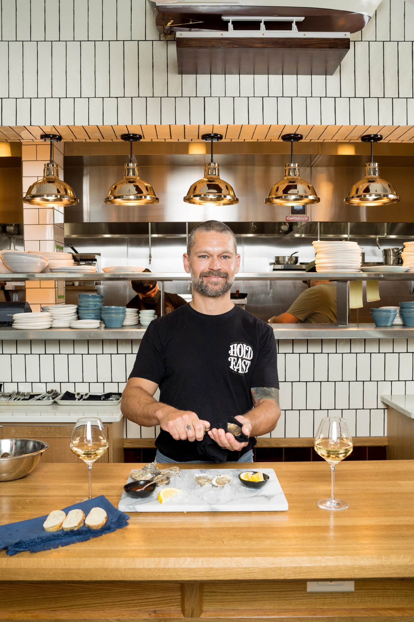 Matt Schwab, owner and operator of Hold Fast Oyster Company, poses in Seabird Restaurant, which will be featuring his oysters during NC Oyster Week. Photo by Justin Kase Conder