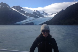 Woman on boat close to glacier