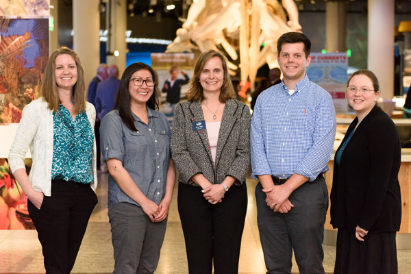 Students who won awards pose with NC Sea Grant executive director at the N.C. Museum of Natural Sciences