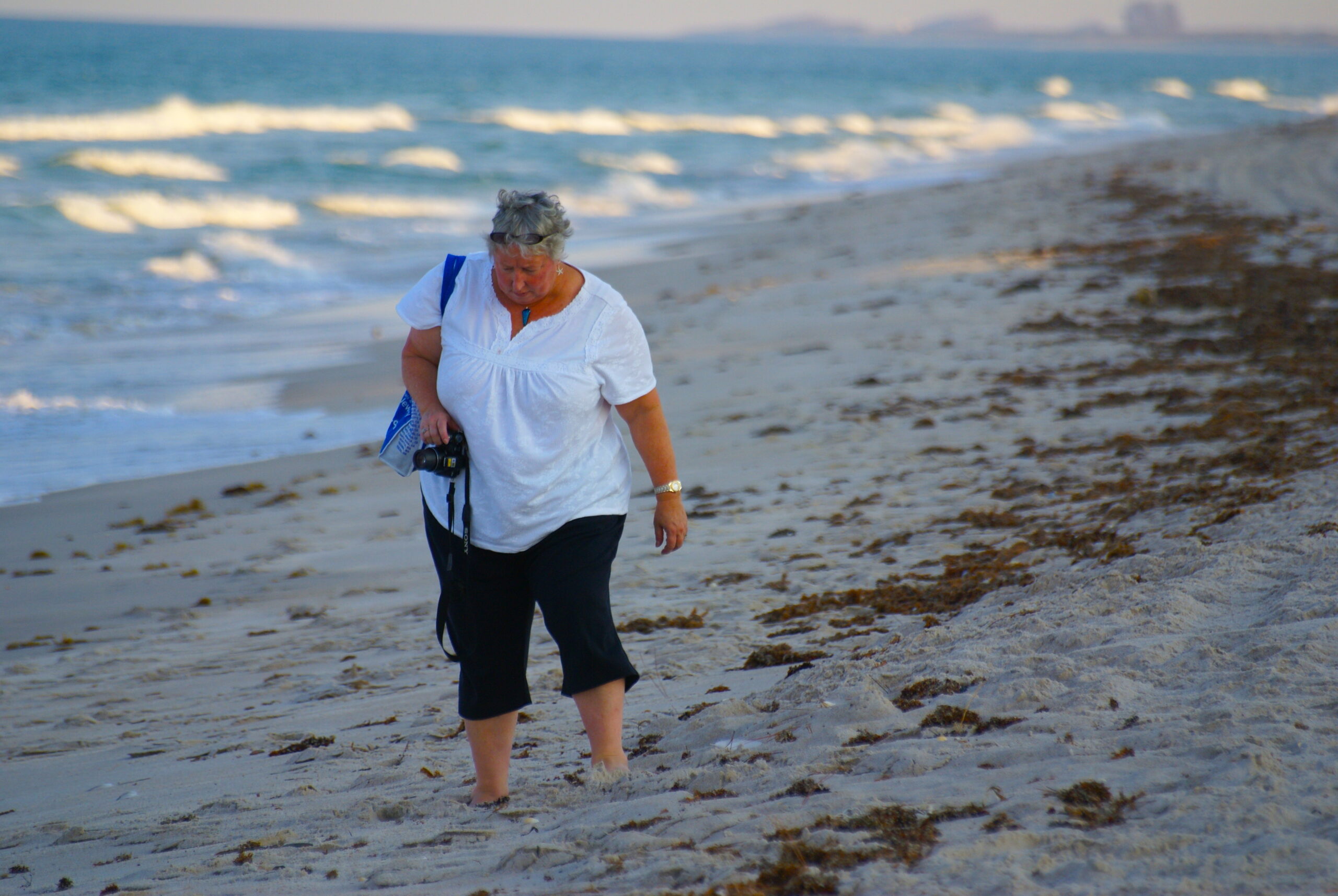 Terri Kirby Hathaway walking along the beach.