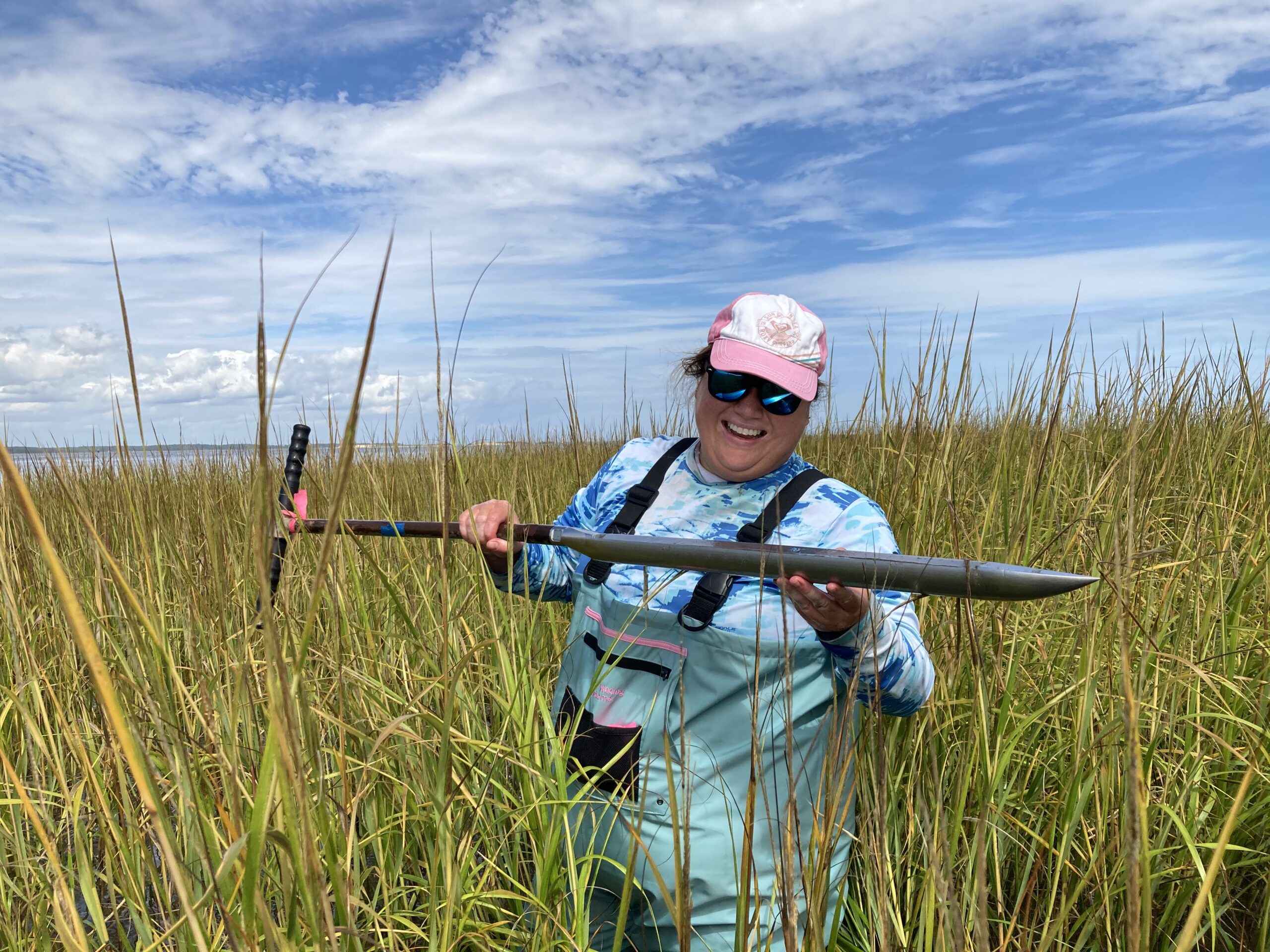 Image of Mariko in the field holding a sediment core