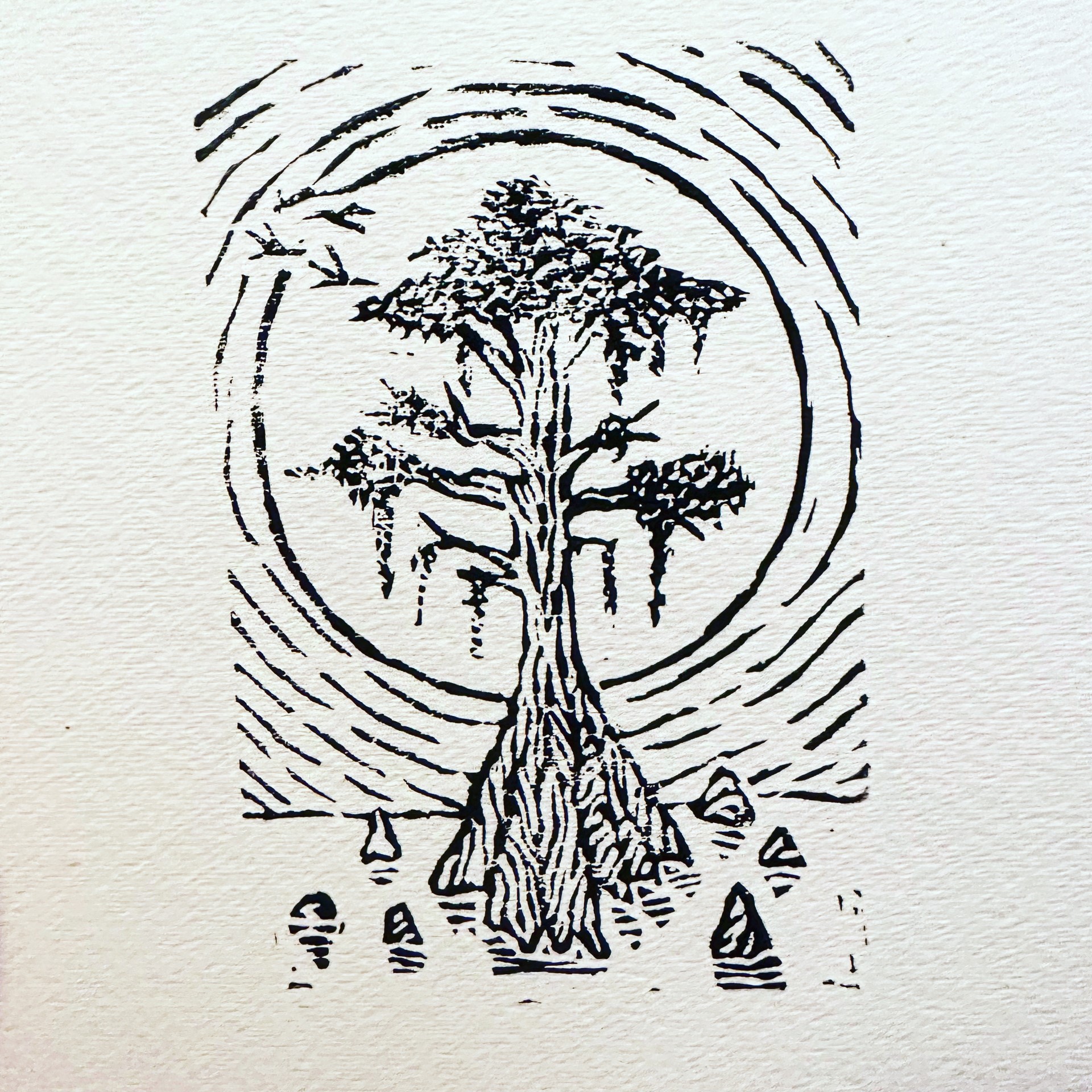 An image of one of Mariko's block prints depicting a tree in watere