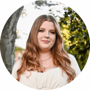 Image: Headshot of Ella Moore with trees in the background