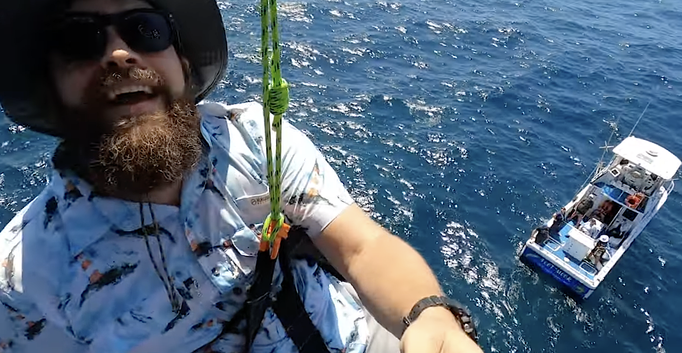 Teacher at the ocean smiles.